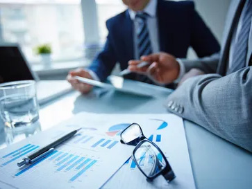 Business leaders reviewing performance data